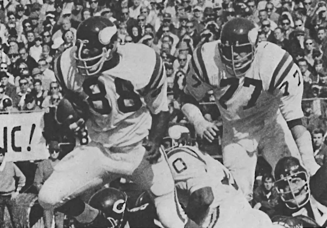Alan Page has the ball! Here is the Vikings Hall of Fame Defensive Tackle with one of the 23 he had in his 15-year career. In 1970 he led the league with 7 - including one returned for a 65-yard score against Chicago.
