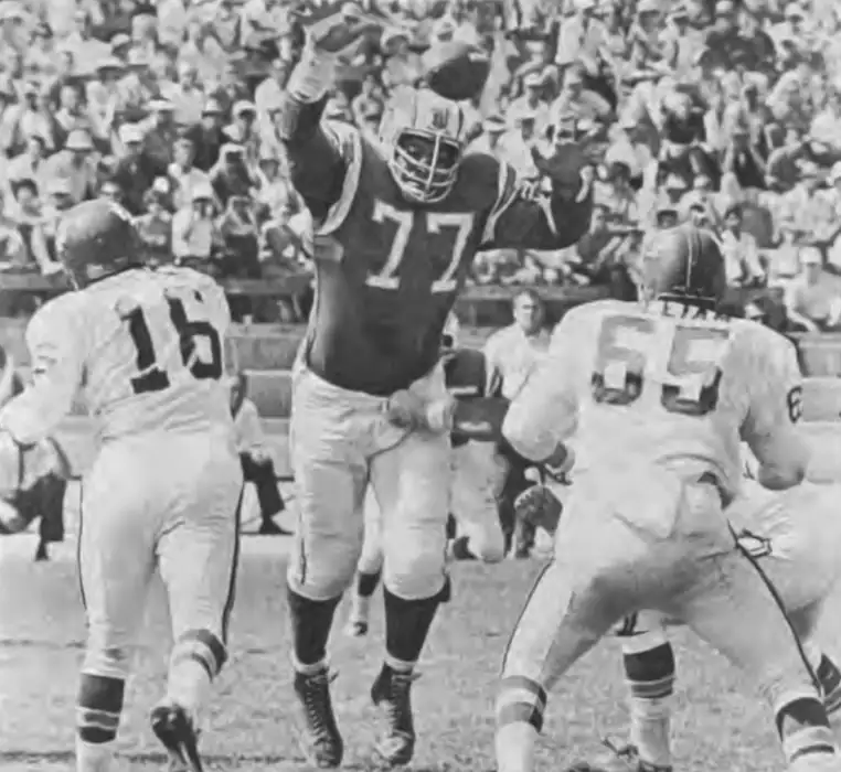The Big Cat breaks through! Ernie Ladd gets into the Chiefs backfield and causes some chaos. That's Len Dawson and Jon Gilliam pictured here.