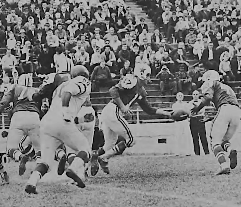 Don Meredith hands off to Don Perkins in this Vintage Early 1960s Dallas Cowboy Picture