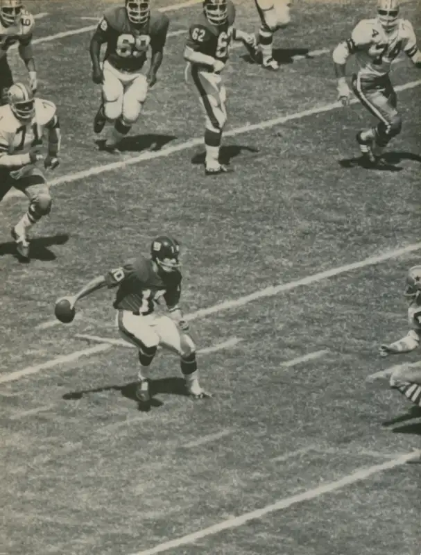 Giants Quarterback Fran Tarkenton scrambles against the Cowboys