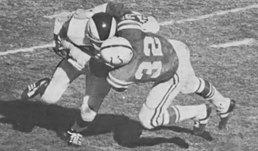 Mike Curtis - the Colts outstanding linebacker of the late 60s and early 70s - put one of his hard-hitting tackles on Rams runner Dick Bass