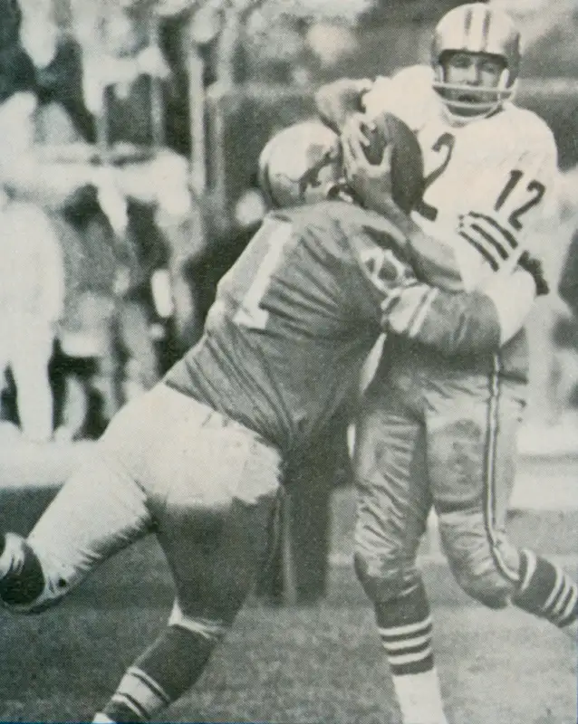 Alex Karras Wraps Up 49er Quarterback John Brodie