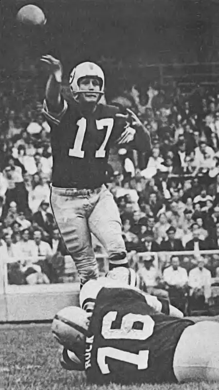 Redskin Billy Kilmer shows off his precision passing form in 1971. That's former 49er Walt Rock in the foreground. Rock, a Pro Bowler in 1965, played 11 seasons in the NFL - 5 in San Francisco and 6 in Washington.