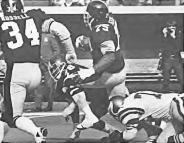 Mean Joe Greene recovers a fumble against the Eagles in 1974. All in all he had 16 fumbles recovered in his 13-year NFL career. That linebacker Andy Russell in the foreground.