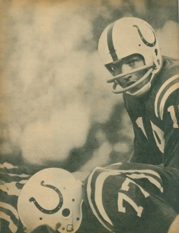 A cool photo of Baltimore Colts Hall of Famer Johnny Unitas lined up before the snap with Hall of Famer Jim Parker in the foreground.
