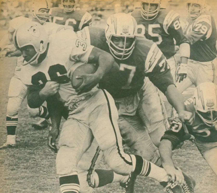 3 AFL All Stars from 1964 - The Raiders Clem Daniels is stopped by Chargers defenders Ernie Ladd and Chuck Allen. The Chargers in the background look like George Gross (#79), Bob Petrich (#85) & Emil Karas (#56).