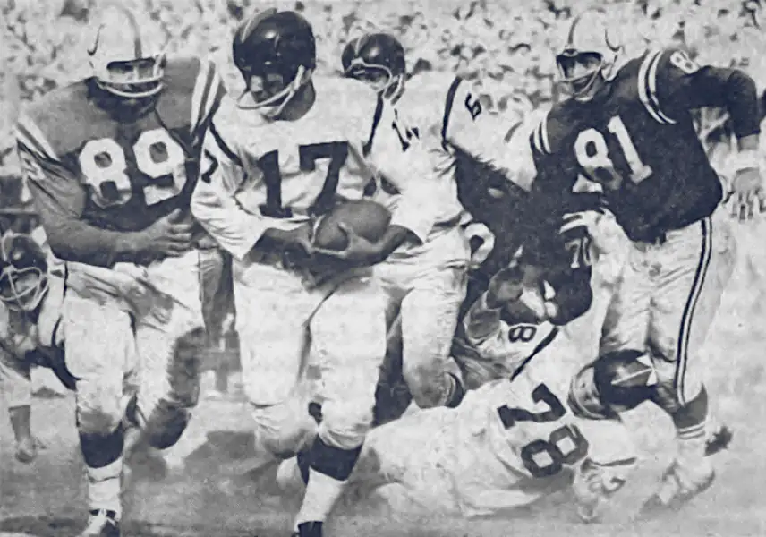 Gino Marchetti and Ordell Braase close in on Redskin quarterback MC Reynolds in 1960