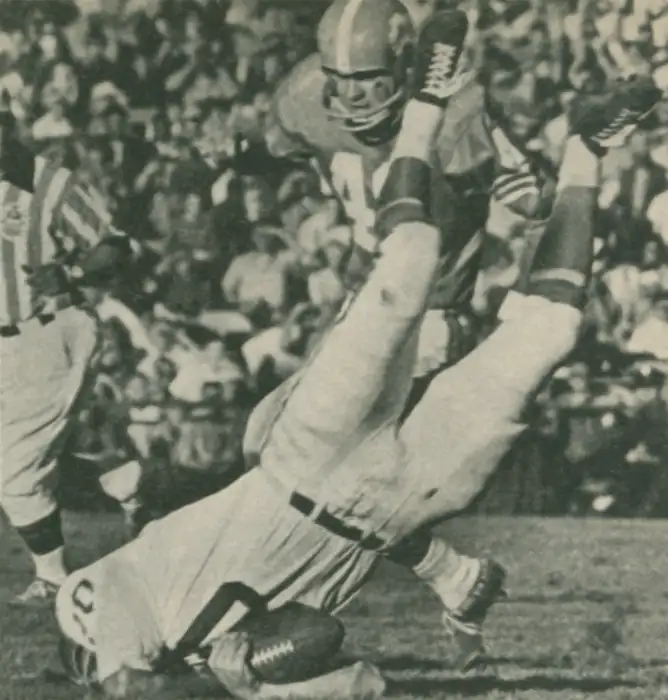 Billy Cannon gets a face full of grass after a tough catch against Denver in 1962. Cannon had an off year in 1962 after a back injury limited his performance.