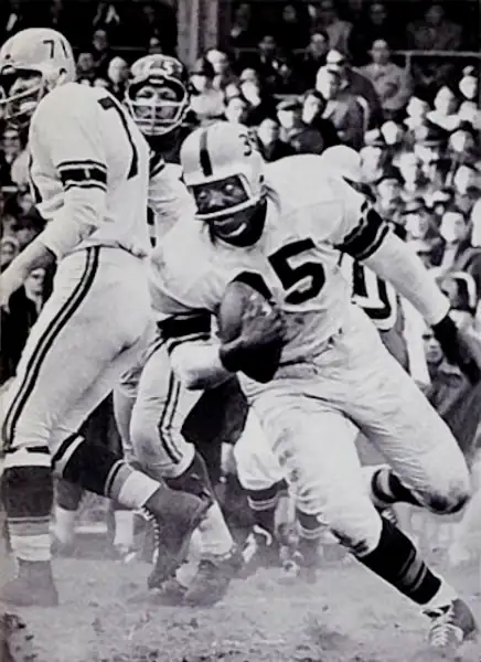 Steelers lineman get between a defender and running back John Henry Johnson