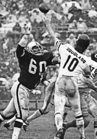 Bobby Douglass gets pass away under an Otis Sistrunk rush