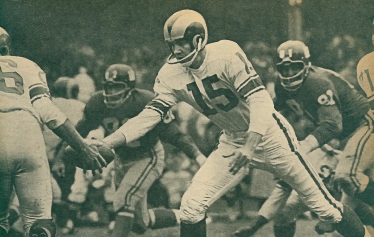 Frank Ryan spent his first 4 seasons in the NFL with the struggling LA Rams. Here is is in 1961 - his last as a Ram playing against the Giants and that's linebacker Tom Scott with lineman Andy Robustelli closing in.