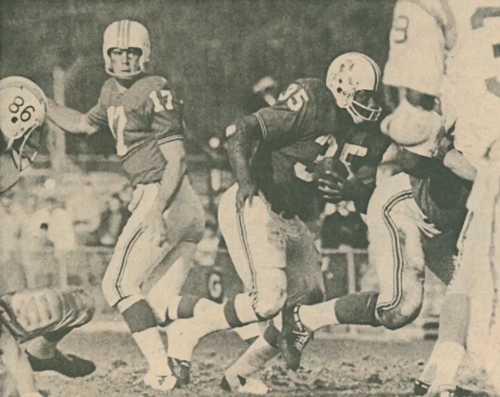 Mike Taliaferro hand off to Jim Nance against the San Diego Chargers in 1969. Taliaferro passed for 2160 yards and 19 touchdowns in 1969 - he also threw 18 interceptions. Nance was the Patriots top rusher with 750 yards and 6 touchdowns. His 222 touches was the most in the AFL too.