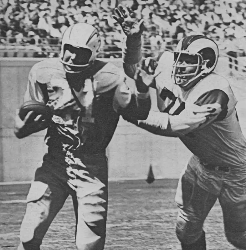 Chargers QB John Hadl won't get away from Merlin Olsen here. From the 1967 AFL-NFL Preseason game between the Rams and Chargers. While it was just exhibition, it was a blowout by the Rams as LA went up 24-0 in the 1st quarter after the defense returned 2 interceptions for touchdowns and forced a fumble that turned into another score. San Diego finally got a touchdown in the 4th quarter as Los Angeles posted a 50-7 win.