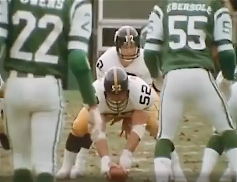 Center Mike Webster lined up and set to snap the ball to Terry Bradshaw. This is from the 1977 game between the Steelers and Jets. Pittsburgh's defense forced 6 turnovers in a 23-20 Pittsburgh win.