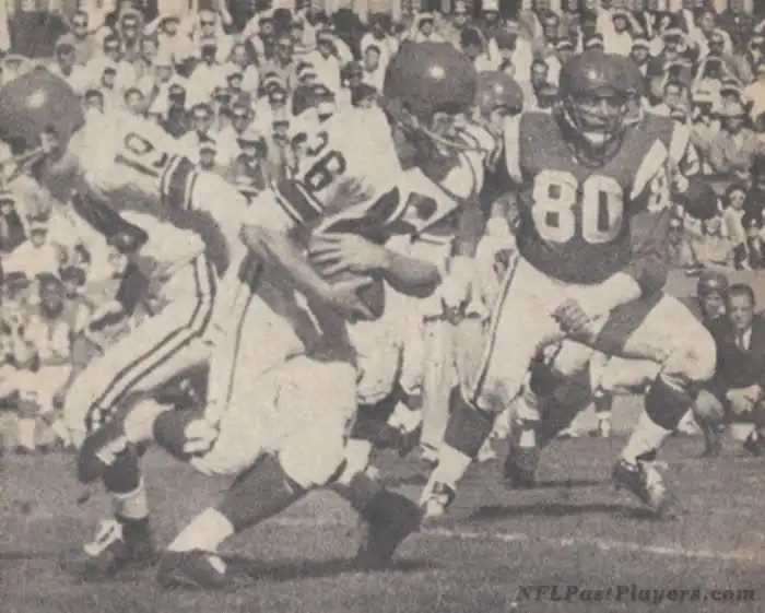 Pulled this one from an old issue of Football Digest — Johnny Unitas hands off to Jon Arnett as Andy Robustelli closes in during the 1961 Pro Bowl. The West came away with a 35–31 victory this day.
