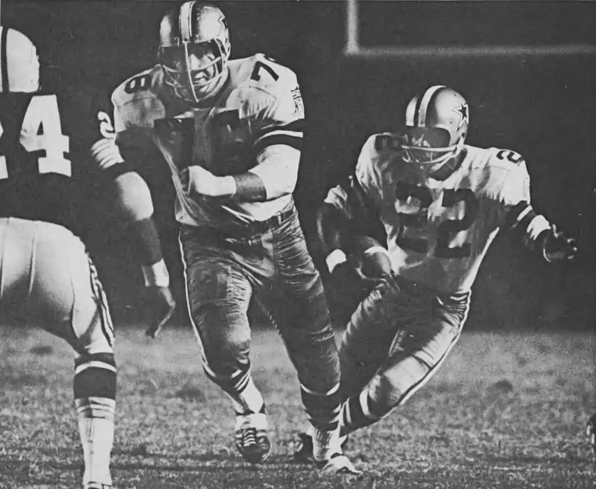 Cowboy Receiver Bob Hayes follows the path of Guard John Niland downfield. Niland was a 3-Time All Pro in Dallas. Hayes, in addition to being a Hall of Famer won Gold Medals in the Olympics.