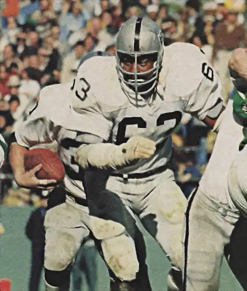 Gene Upshaw out in front of a Raider running back. He did so for 15 years.