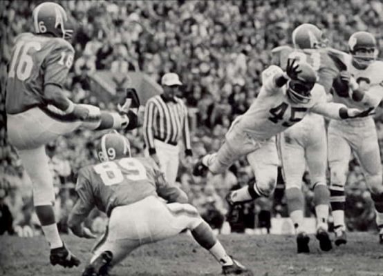 Houston Oilers kicker George Blanda kicks against the Dallas Texans.