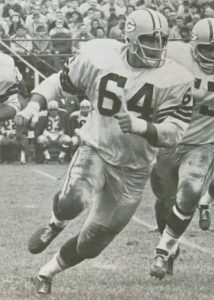 Black & White picture of Green Bay Packers offensive guard Jerry Kramer pulling out to block on a sweep.