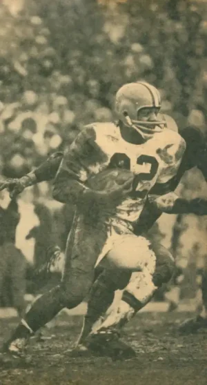 Classic action photo of NFL Rushing Legend Jim Brown