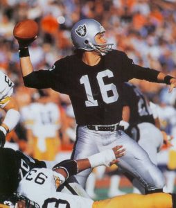 Raiders QB Jim Plunkett setting up to pass