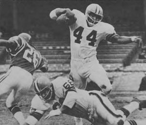 Browns runner Leroy Kelly running behind guard Gene Hickerson.