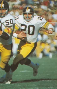 Rocky Bleier gets behind the blocking of lineman Jim Clack.